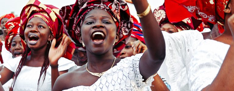 African women celebrating in traditional clothing